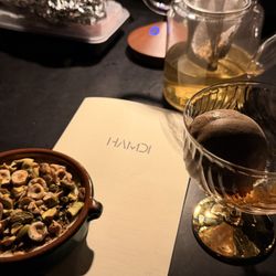 Hamdi - Rice pudding dessert with pistachios Bebek ice cream (carob and whiskey) on the right