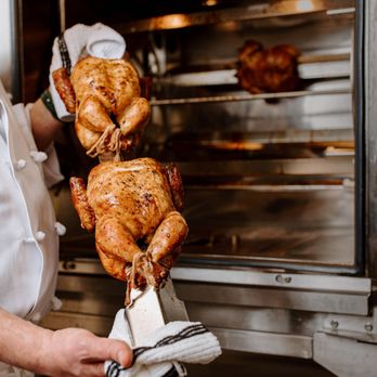 Venue Coffee - a chef holding a roasting turkey - Coffee & Tea Near Me - Ann Arbor, Michigan