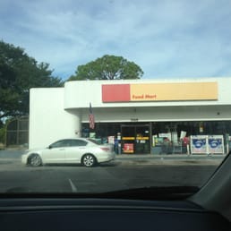 a car parked in front of a convenience store