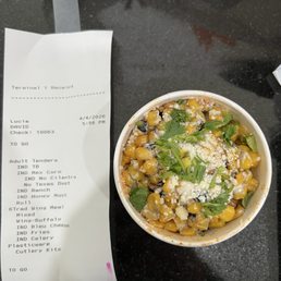 Mexican street corn with plenty of cilantro despite ordering it without Mexican street corn with plenty of cilantro despite ordering it without
