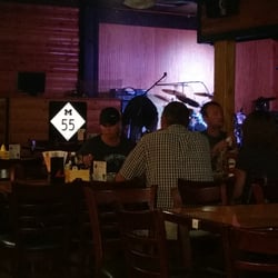 M55 Pour House - No booths, but the standard tables and high-tops are comfortable. Bands on weekends. They were setting up when we were there.