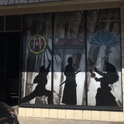 Window signage! AMP Legacy home of Abad Mancia Martial Arts and Maileilani Ohana Hula.