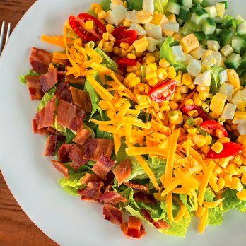 Shoney's - Our cobb salad has crisp romaine lettuce, crumbled bacon, chopped egg, tomato & corn relish, cheddar cheese, and chopped cucu... - New American Near Me - Belle, West Virginia Shoney's - Our cobb salad has crisp romaine lettuce, crumbled bacon, chopped egg, tomato & corn relish, cheddar cheese, and chopped cucu... - New American Near Me - Belle, West Virginia