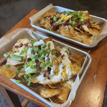 Eden Abbey Brewing Community - Kettle chip nachos with queso, ranch and bacon topped with onions - Brewpubs Near Me - Mount Dora, Florida Eden Abbey Brewing Community - Kettle chip nachos with queso, ranch and bacon topped with onions - Brewpubs Near Me - Mount Dora, Florida
