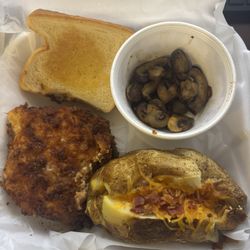 Ruger's Grill - Fried chicken dinner with a side of grilled mushrooms and loaded baked potato.