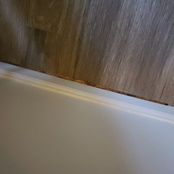 Renfro Renovators - a white bathtub in a bathroom - General Contractors Near Me Renfro Renovators - a white bathtub in a bathroom - General Contractors Near Me