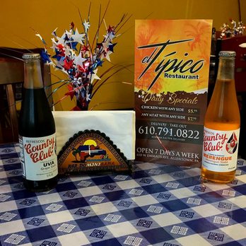 El Tipico - a table with a blue and white checkered tablecloth and a bottle of typeo - Dominican Near Me - Allentown, Pennsylvania El Tipico - a table with a blue and white checkered tablecloth and a bottle of typeo - Dominican Near Me - Allentown, Pennsylvania