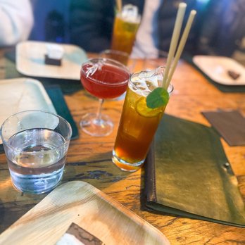 Kingfisher - a couple of drinks on a table - Bars Near Me - Durham, North Carolina