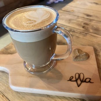 Ella Cafe - Almond milk latte on a Ella board - Coffee & Tea Near Me - Plantation, Florida