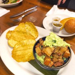 Sabores Latin Cuisine - Tostones with fresh gucomole top with chicharron