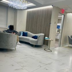Nisim Dental - Weirdly shaped couches wedged into a small space, very awk for patients. no chargers, no leg space & a random small table on the side