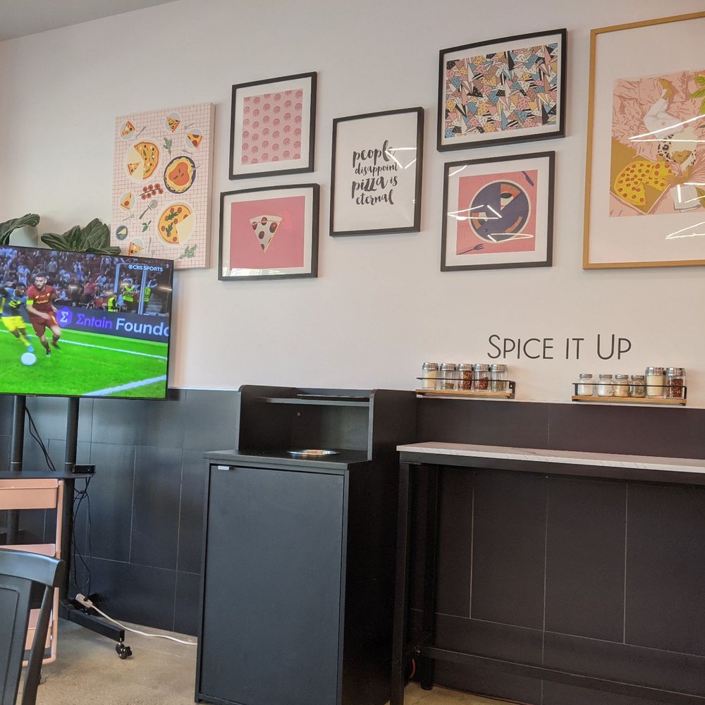 Pizzeria G - TV, art, spice rack. - Pizza Near Me - Garden City, New York Pizzeria G - TV, art, spice rack. - Pizza Near Me - Garden City, New York