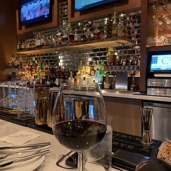 C2 Steak & Seafood - a glass of wine on the bar - Steakhouses Near Me - Brooks, California C2 Steak & Seafood - a glass of wine on the bar - Steakhouses Near Me - Brooks, California