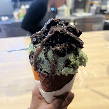 SnoCream Company - Oreo matcha ice cream topped with Oreos and Nutella drizzle in red velvet cone - Desserts Near Me - Annandale, Virginia