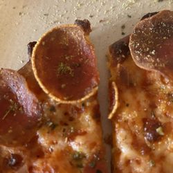 Pizza Hut - Tavern style pepperoni pizza which is supposed to be fresh from the oven. The pepperoni was so old it had discolored.
