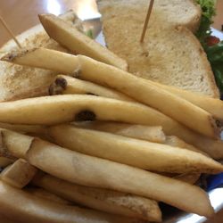 Twisters Eatery and Bed & Breakfast - Club sandwich on toasted sourdough with home fries