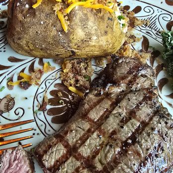 Gaskins Cabin Steakhouse - KC Strip, cooked the way I love it. Also pictured is the baked potato. - Steakhouses Near Me - Eureka Springs, Arkansas
