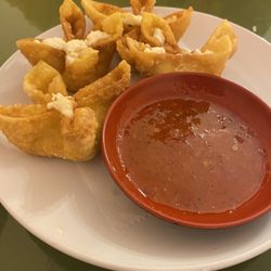 Señor Sushi - Crab Rangoon with chili sauce.    We had already dug in; order was 6.