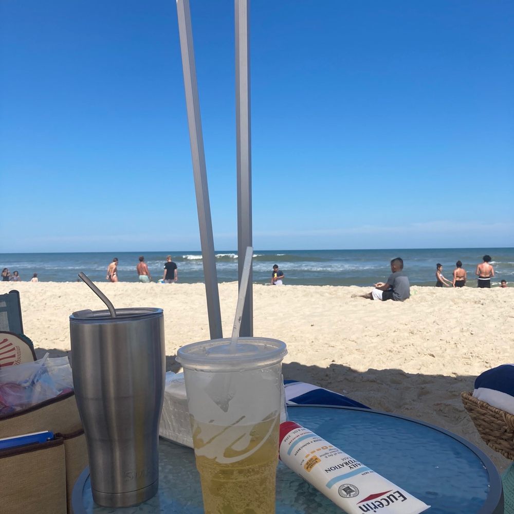 Wild Horse Cabanas - Relaxing under the tent with our favorite refreshers. - Beach Equipment Rentals Near Me