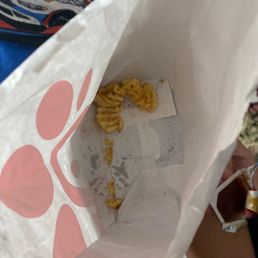 ows a person holding a bag of macaroni and cheese