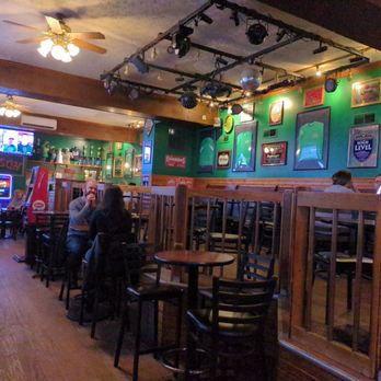 Zeno's - people sitting at tables in a restaurant - Dive Bars Near Me - Columbus, Ohio