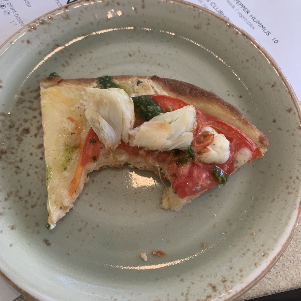 a slice of pizza on a plate