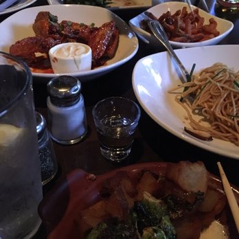 Yard House - Traditional Wings (Korean BBQ), Sweet Potato Fries, Crispy Brussels Sprouts & Potatoes, Shiitake Garlic Noodles - New American Near Me - Rancho Mirage, California