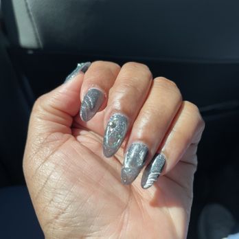 Me Time Nail Lounge - Gel X nail almond shape + Black cat's eye polish complete with design and stones. - Nail Salons Near Me - Redondo Beach, California Me Time Nail Lounge - Gel X nail almond shape + Black cat's eye polish complete with design and stones. - Nail Salons Near Me - Redondo Beach, California