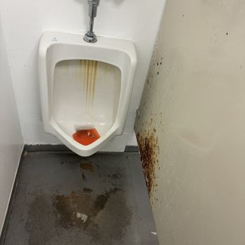 Renditions Golf Course - This is the men's restroom on the course at the food stand. "You can do better better" - especially for $127 (with a small bucket) - Golf Near Me - Davidsonville, Maryland