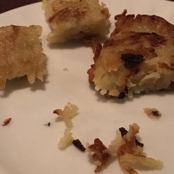 Waldhorn Restaurant - Gnat or flea on side plate. It wasn't there before the kartoffelpuffer was placed from it's serving dish into the side plate. - German Near Me - Pineville, North Carolina