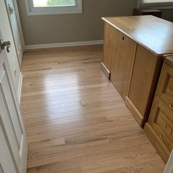 Kara Flooring - a room with a desk and a window - Flooring Near Me