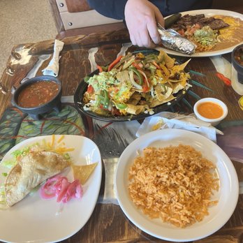 El Molcajete Authentic Mexican Food - Shredded beef taco, rice, cheese nachos, carne, Asada plate, spicy orange salsa - Mexican Near Me - Orem, Utah El Molcajete Authentic Mexican Food - Shredded beef taco, rice, cheese nachos, carne, Asada plate, spicy orange salsa - Mexican Near Me - Orem, Utah