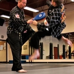 American Dojo - Master Konley drilling kicks with his son, Zach.