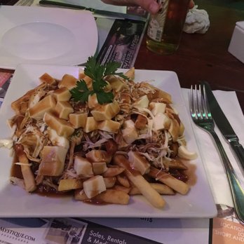 Los Tabernacos - Poutine with tasteless gravy and cold cheese - Sports Bars Near Me - Playa del Carmen, ROO Los Tabernacos - Poutine with tasteless gravy and cold cheese - Sports Bars Near Me - Playa del Carmen, ROO