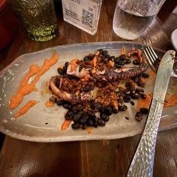 Octopus legs with chorizo and beans. Octopus legs with chorizo and beans.
