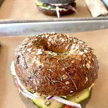 Rye Deli & Drink - thyme and salt bagel with hummus and "stacked" with veggies - Delis Near Me - Chicago, Illinois Rye Deli & Drink - thyme and salt bagel with hummus and "stacked" with veggies - Delis Near Me - Chicago, Illinois