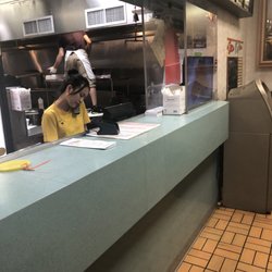 China House - Sneakers on prep station while serving food