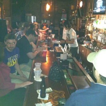 The Balcony  -  group of people sitting at a bar - Pubs Near Me - Houma, Louisiana