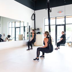 Soaring Bungee Fitness Studio - Squats are super fun in the bungee harness.