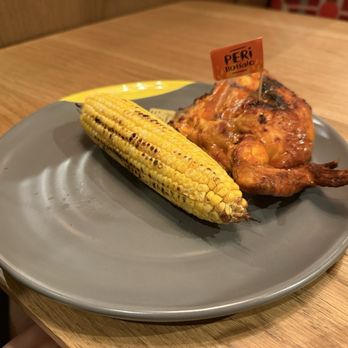 Nando's Peri-Peri - Buffalo seasoning with corn side - Chicken Shop Near Me - Houston, Texas