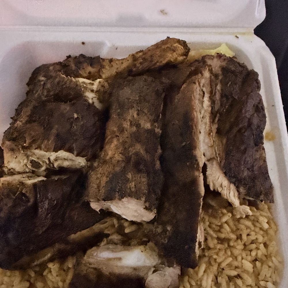 Jerk pork ribs and chicken with cabbage and rice & peas Jerk pork ribs and chicken with cabbage and rice & peas