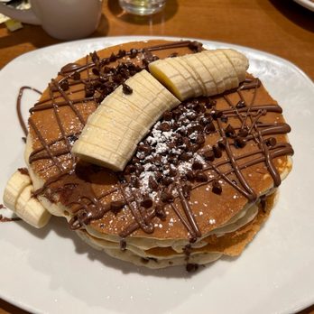 Canela Cafe - Chunky Monkey Pancakes sans walnuts. A+ - Breakfast & Brunch Near Me - Milwaukee, Wisconsin