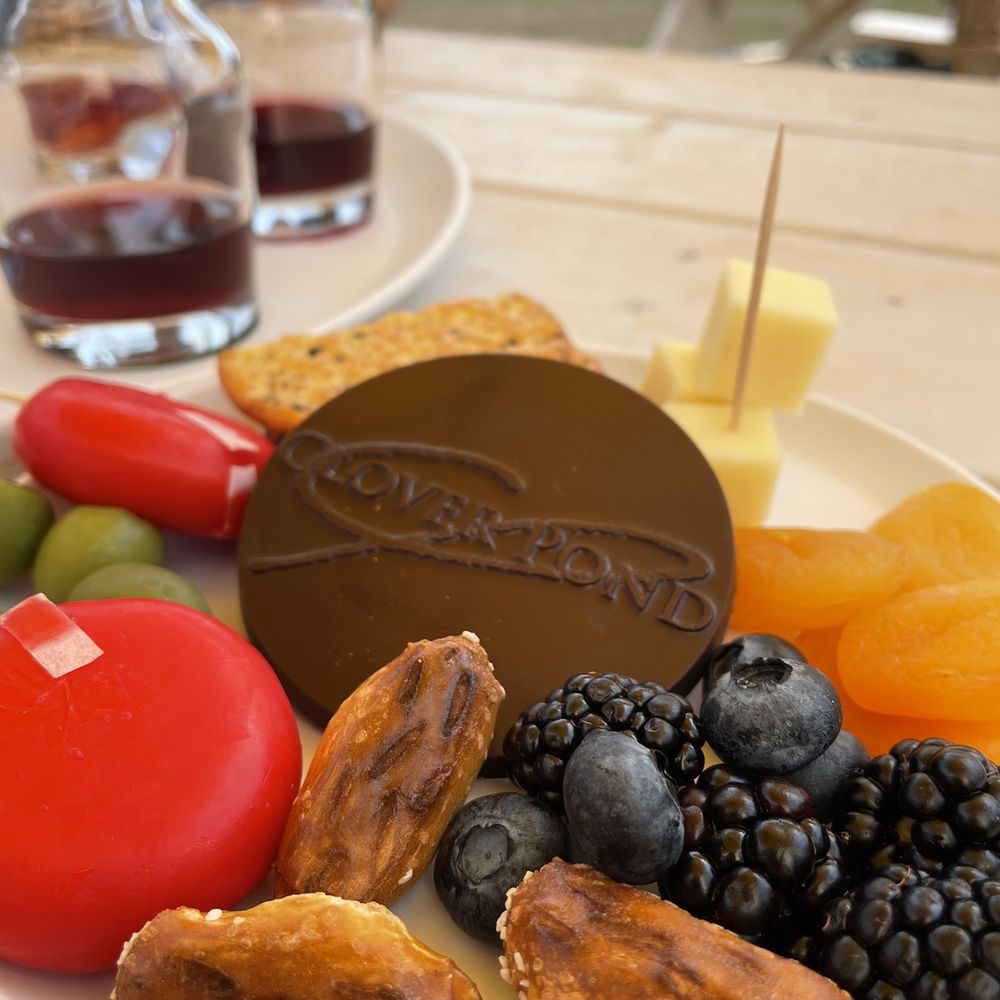 Clover Pond Vineyard - a plate of fruit and chocolate - Wine Tasting Room Near Me - Altamont, New York