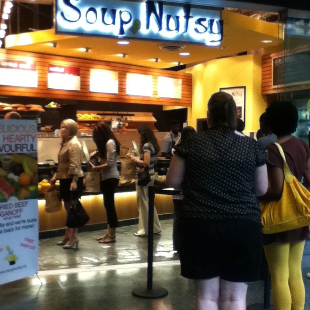 a group of people standing in line a group of people standing in line