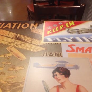 Wingstop - Cool artwork on tables - Chicken Wings Near Me - Riverside, California