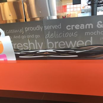 Dunkin' -  an orange counter with a sign on it - Coffee & Tea Near Me - Lake Bluff, Illinois