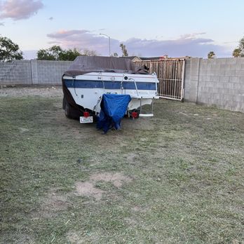 Roberts Landscaping Services - a trailer with a tarp on it - Landscaping Near Me
