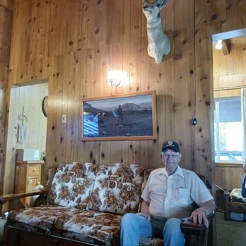 Kudar Log Cabins - Waiting for the clerk on "grandma's couch". - Hotels Near Me - Jackson, Wyoming Kudar Log Cabins - Waiting for the clerk on "grandma's couch". - Hotels Near Me - Jackson, Wyoming