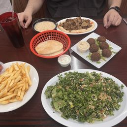 Tabouli salad, french fries, falafel, pita, hummus and kebab. Tabouli salad, french fries, falafel, pita, hummus and kebab.