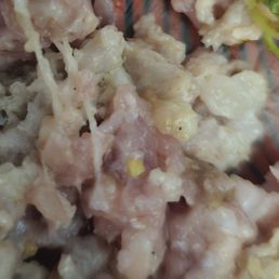 Raw sausage from seafood bucket